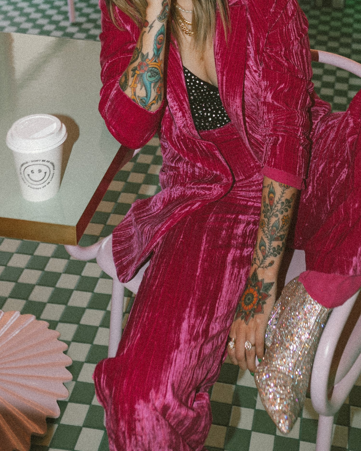 stylish lady in red velvet enjoying a coffee drink in a stylish coffee shop